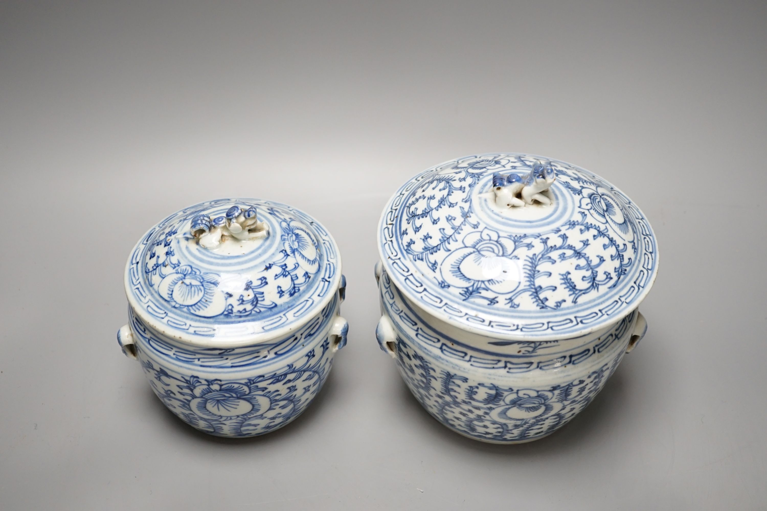 Two Chinese blue and white jars and covers - tallest 20cm high